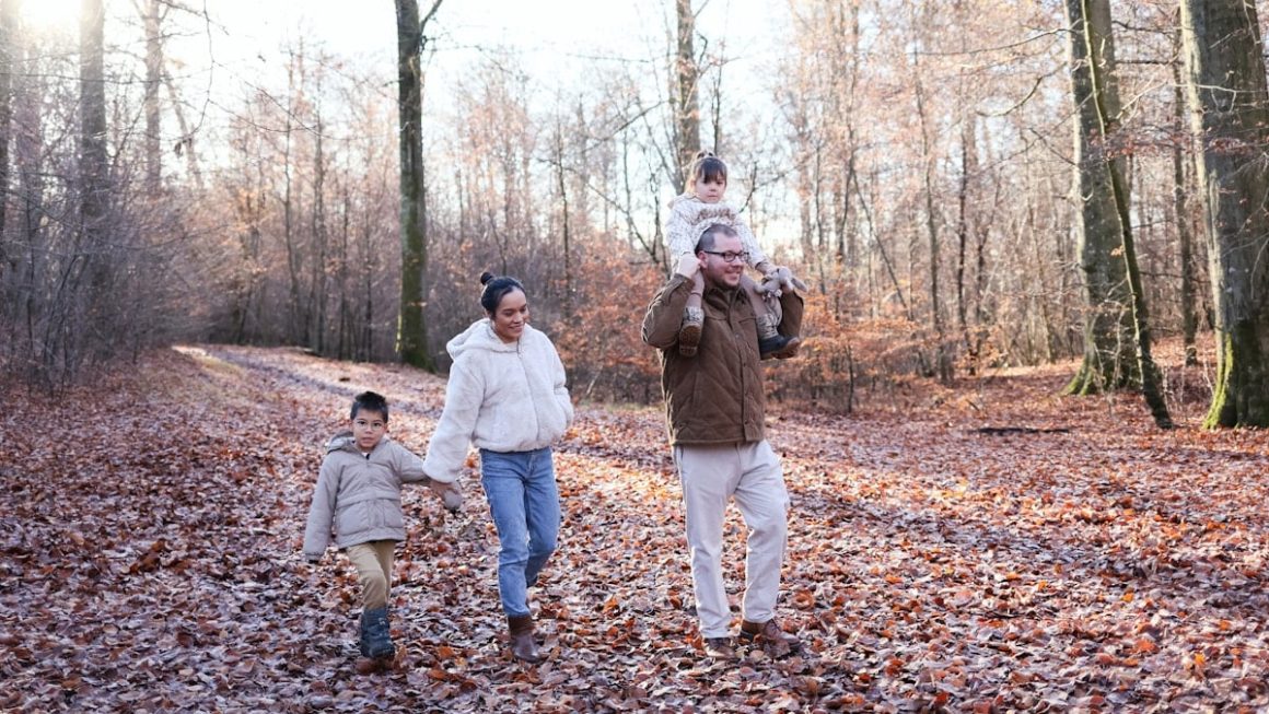 Family walking on a path in a forest